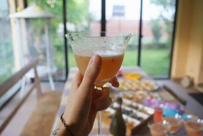 champagne cocktail being held by hand