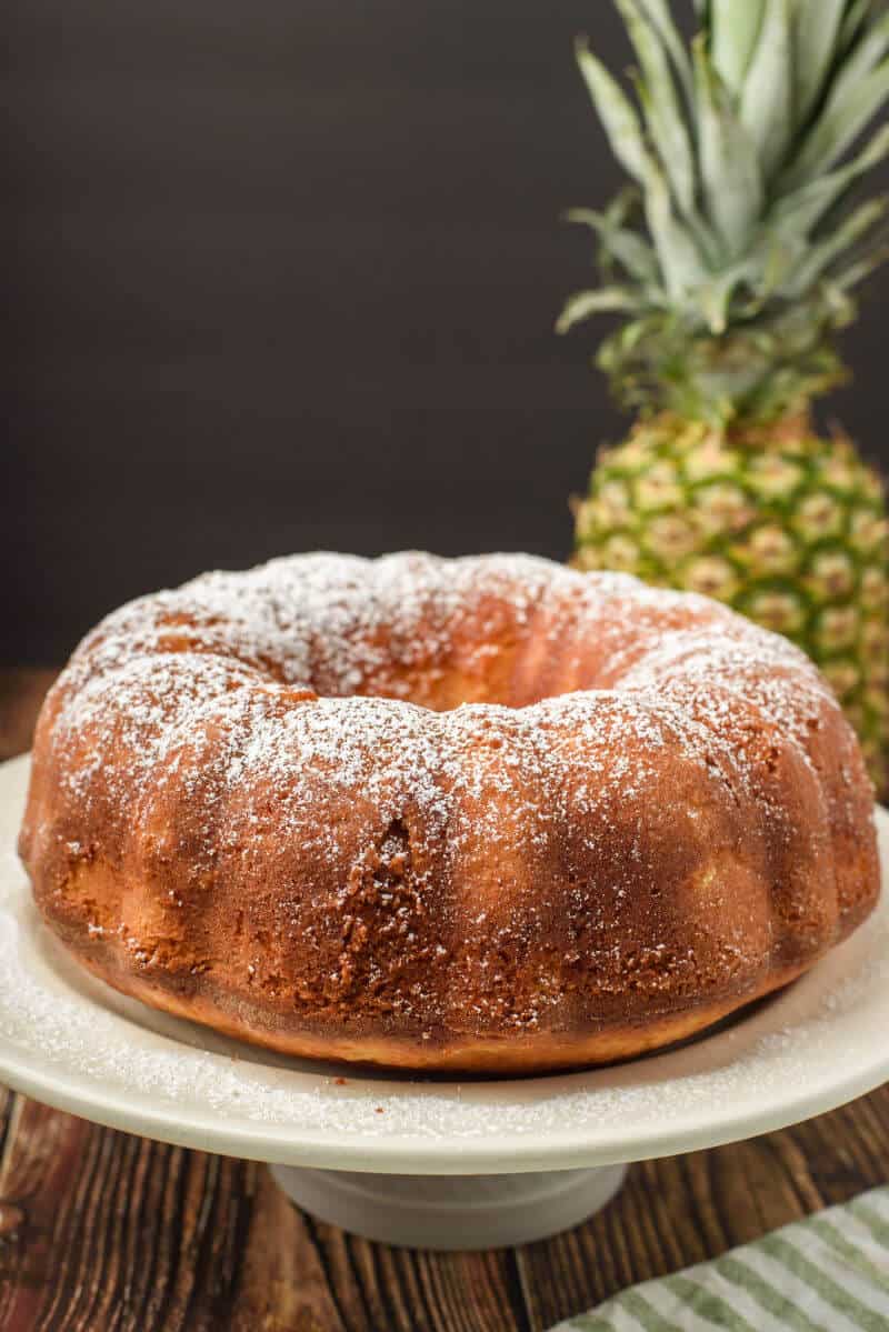 pineapple pound cake on cake stand baked in a bundt pan