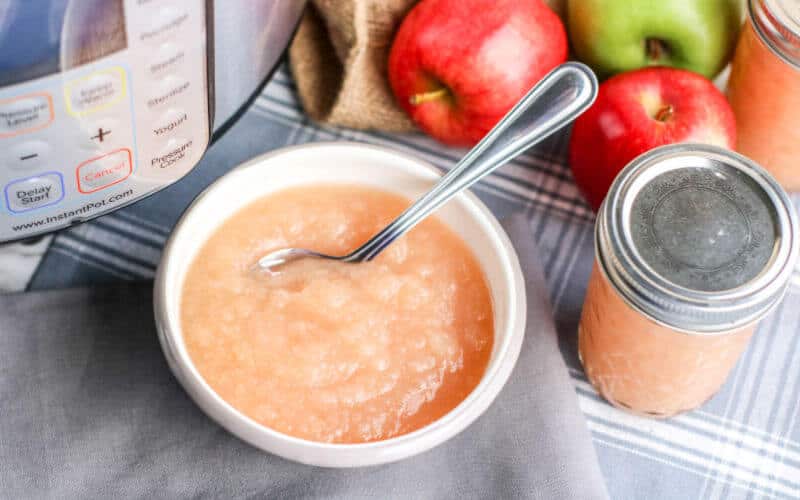 instant pot applesauce on table with instant pot
