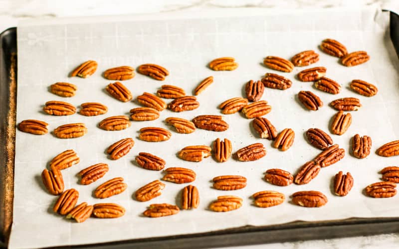 pecans on dish ready to roast and use in pecan praline