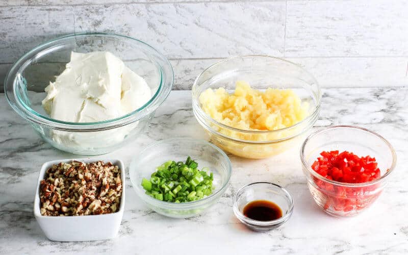 ingredients for the pineapple cheeseball in clear bowls