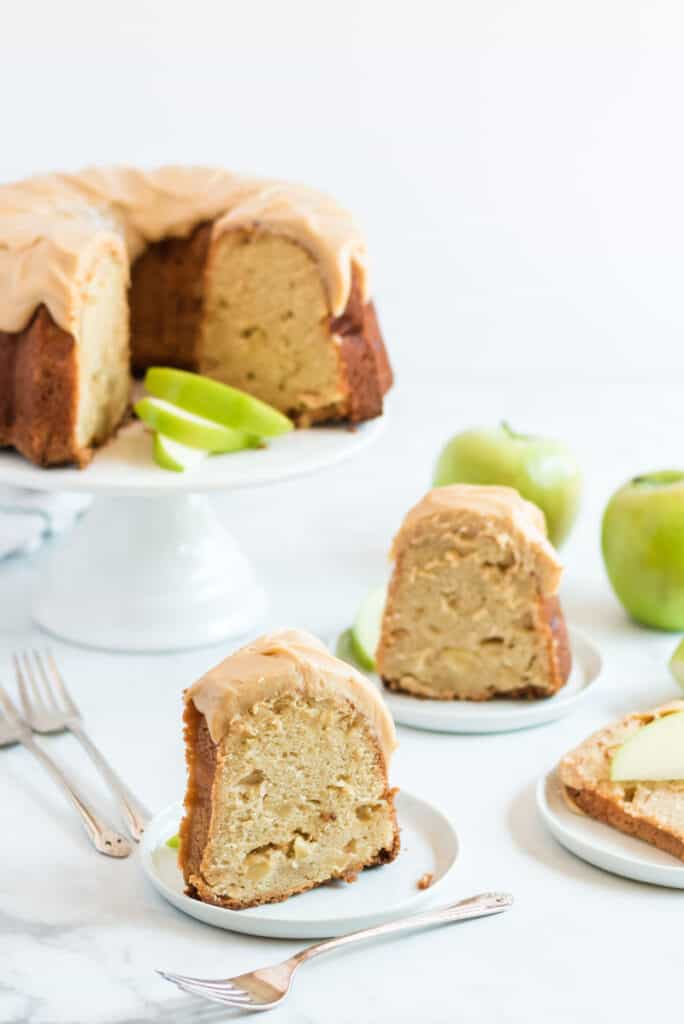 slices of caramel apple pound cake with frosting