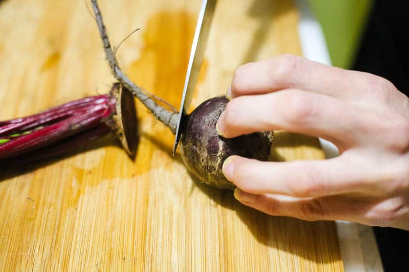 cutting a beet to pickle it
