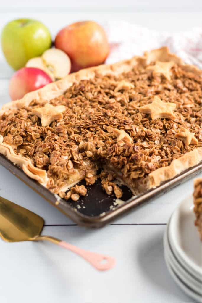 apple slab pie with star crusts and apples on table