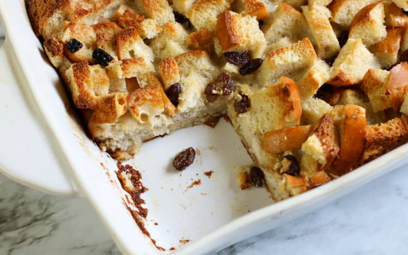 bread pudding in casserole dish on marble table
